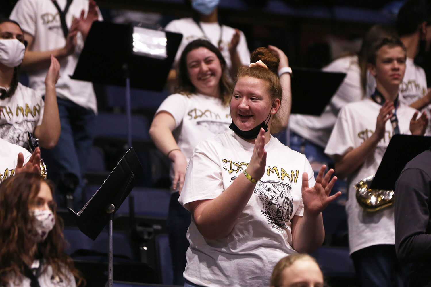 Madison Billings, center, laughs with a neighboring bandmate